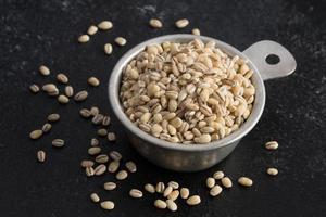 Uncooked Pearled Barley in a Measuring Cup photo