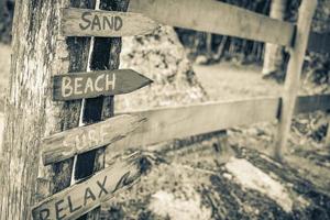 Sand beach surf relax colorful directional arrows Ilha Grande Brazil. photo