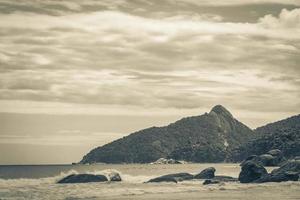 Rocks waves Praia Lopes Mendes beach Ilha Grande island Brazil. photo