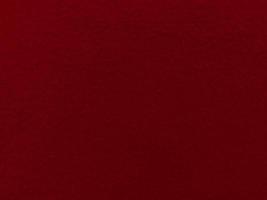 Felt red soft rough textile material background texture close up,poker table,tennis ball,table cloth. Empty red fabric background. photo