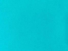 Turquoise velvet fabric texture used as background. Empty turquoise fabric background of soft and smooth textile material. There is space for text. photo