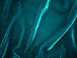 emerald green velvet fabric texture used as background. Empty emerald green fabric background of soft and smooth textile material. There is space for text. photo