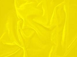 Yellow velvet fabric texture used as background. Empty yellow fabric background of soft and smooth textile material. There is space for text. photo