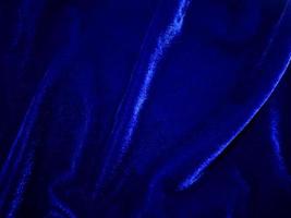 Blue velvet fabric texture used as background. Empty Bluefabric background of soft and smooth textile material. There is space for text. photo