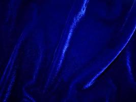 Blue velvet fabric texture used as background. Empty Bluefabric background of soft and smooth textile material. There is space for text. photo