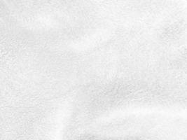 White clean wool texture background. light natural sheep wool. white seamless cotton. texture of fluffy fur for designers. close-up fragment white wool carpet.. photo