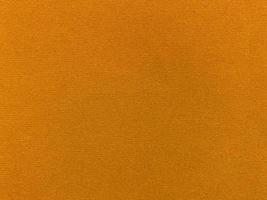 yellow velvet fabric texture used as background. Empty yellow fabric background of soft and smooth textile material. There is space for text.. photo