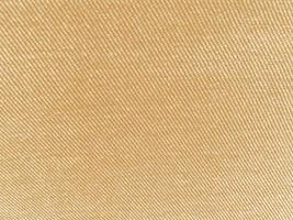 Brown ribbed corduroy texture background. Corduroy fabric texture  used as background. Empty brown fabric background of soft and smooth textile material. There is space for text. photo