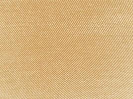 Brown ribbed corduroy texture background. Corduroy fabric texture  used as background. Empty brown fabric background of soft and smooth textile material. There is space for text. photo