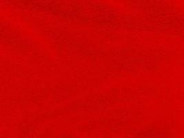 fondo de textura de lana limpia roja. lana de oveja natural ligera. algodón rojo sin costuras. textura de piel esponjosa para diseñadores el día de navidad. primer fragmento alfombra de lana roja..