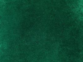 Dark green old velvet fabric texture used as background. Empty green fabric background of soft and smooth textile material. There is space for text... photo