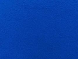 Felt  blue soft rough textile material background texture close up,poker table,tennis ball,table cloth. Empty blue fabric background. photo