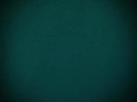 Dark green old velvet fabric texture used as background. Empty green fabric background of soft and smooth textile material. There is space for text. photo