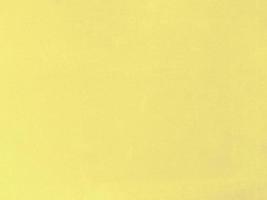Pastel yellow velvet fabric texture used as background. Empty yellow fabric background of soft and smooth textile material. There is space for text. photo