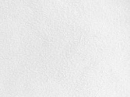 fieltro blanco suave áspero material textil textura de fondo de cerca, mesa de póquer, pelota de tenis, mantel. fondo de tela blanca vacía. foto