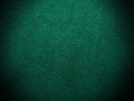 Dark green old velvet fabric texture used as background. Empty green fabric background of soft and smooth textile material. There is space for text.. photo