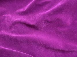 Dark purple old velvet fabric texture used as background. Empty purple fabric background of soft and smooth textile material. There is space for text.. photo