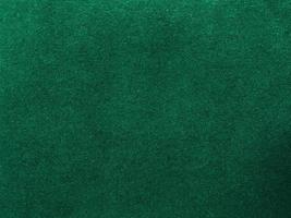 Dark green old velvet fabric texture used as background. Empty green fabric background of soft and smooth textile material. There is space for text.. photo