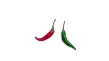 Fresh red and green chili peppers placed on a white background, great for editing and advertising spicy foods. photo