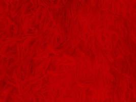 Red clean wool texture background. light natural sheep wool. red seamless cotton. texture of fluffy fur for designers christmas day. close-up fragment red wool carpet.. photo