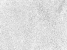 White clean wool texture background. light natural sheep wool. white seamless cotton. texture of fluffy fur for designers. close-up fragment white wool carpet. photo