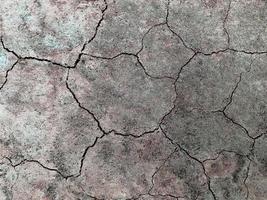 superficie del suelo agrietada, superficie rugosa marrón, según el concepto de sequía o falta de humedad. adecuado para el fondo foto