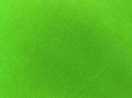 Green old velvet fabric texture used as background. Empty green fabric background of soft and smooth textile material. There is space for text.. photo