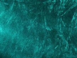 Dark green old velvet fabric texture used as background. Empty green fabric background of soft and smooth textile material. There is space for text.. photo