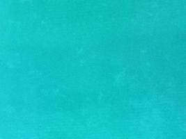 turquoise old velvet fabric texture used as background. Empty turquoise fabric background of soft and smooth textile material. There is space for text. photo