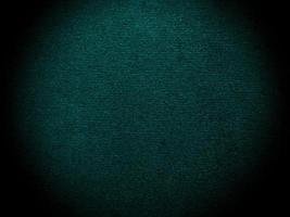 Dark green old velvet fabric texture used as background. Empty green fabric background of soft and smooth textile material. There is space for text... photo