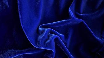 textura de tela de terciopelo azul utilizada como fondo. fondo de tela azul vacío de material textil suave y liso. hay espacio para el texto. foto