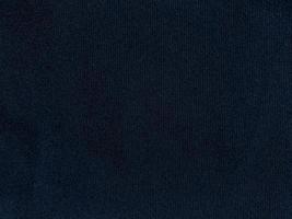 Dark blue velvet fabric texture used as background. Empty dark blue fabric background of soft and smooth textile material. There is space for text. photo
