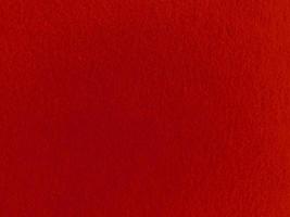 Felt red soft rough textile material background texture close up,poker table,tennis ball,table cloth. Empty red fabric background. photo