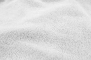 White clean wool  texture background. light natural sheep wool. white seamless cotton. texture of fluffy fur for designers. close-up fragment white wool carpet. photo