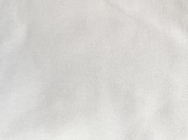 The texture of the old white fabric has a vintage dullness, there is a text area for the background, used for vintage wallpapers and designs. photo