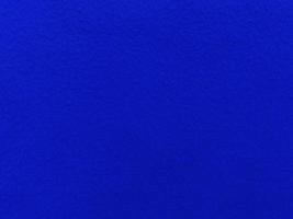 Felt  blue soft rough textile material background texture close up,poker table,tennis ball,table cloth. Empty blue fabric background. photo