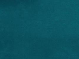 Dark green velvet fabric texture used as background. Empty dark green  fabric background of soft and smooth textile material. There is space for text. photo