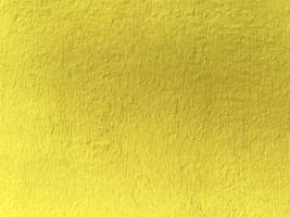 Seamless texture of yellow shadow cement old wall a rough surface, with space for text, for a background. photo