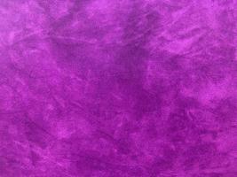 Purple velvet fabric texture used as background. Empty purple fabric background of soft and smooth textile material. There is space for text. photo