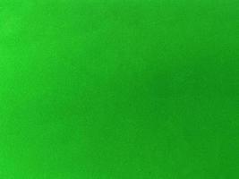 Dark green velvet fabric texture used as background. Empty green fabric background of soft and smooth textile material. There is space for text. photo