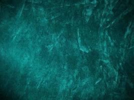 Dark green old velvet fabric texture used as background. Empty green fabric background of soft and smooth textile material. There is space for text.. photo