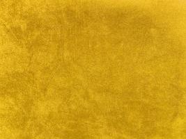 Yellow velvet fabric texture used as background. Empty yellow fabric background of soft and smooth textile material. There is space for text... photo
