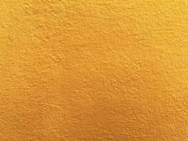 Seamless texture of yellow cement wall a rough surface, with space for text, for a background. photo