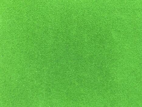 green velvet fabric texture used as background. Empty green fabric background of soft and smooth textile material. There is space for text. photo