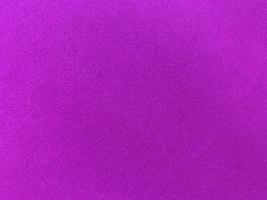 Dark purple old velvet fabric texture used as background. Empty purple fabric background of soft and smooth textile material. There is space for text... photo