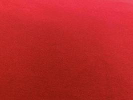 Red velvet fabric texture used as background. Empty red fabric background of soft and smooth textile material. There is space for text.. photo