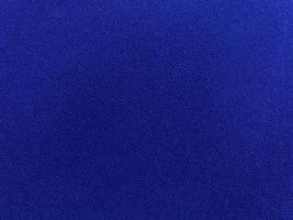 Dark blue velvet fabric texture used as background. Empty dark blue fabric background of soft and smooth textile material. There is space for text. photo