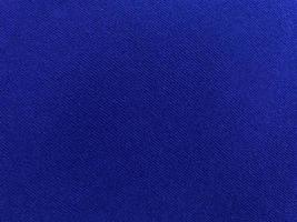 Dark blue velvet fabric texture used as background. Empty dark blue fabric background of soft and smooth textile material. There is space for text. photo