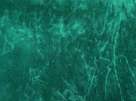 Dark green old velvet fabric texture used as background. Empty green fabric background of soft and smooth textile material. There is space for text... photo