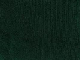 Dark green old velvet fabric texture used as background. Empty green fabric background of soft and smooth textile material. There is space for text. photo